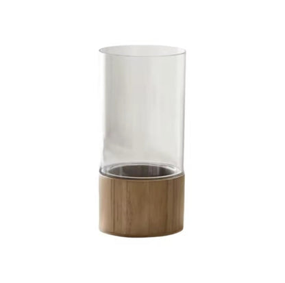 The Atelier Vase in clear acrylic with a light wood round base