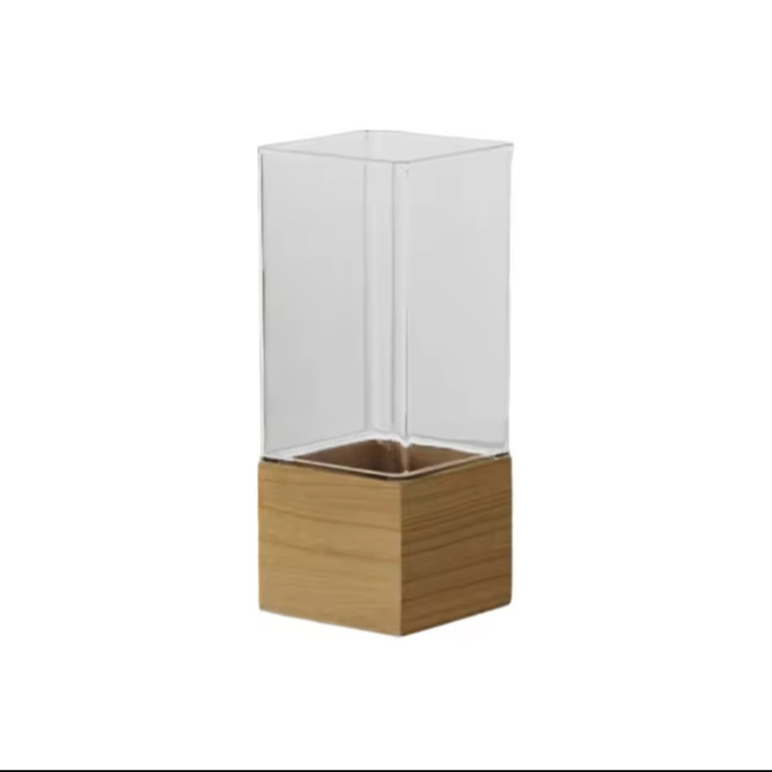 The Atelier Vase in clear acrylic with a light wood square base